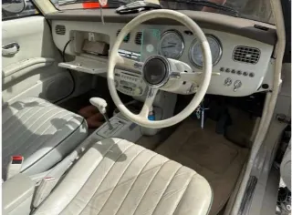 Foto 8 di 8: Nissan Figaro | 1991 | Route 66 Auctions